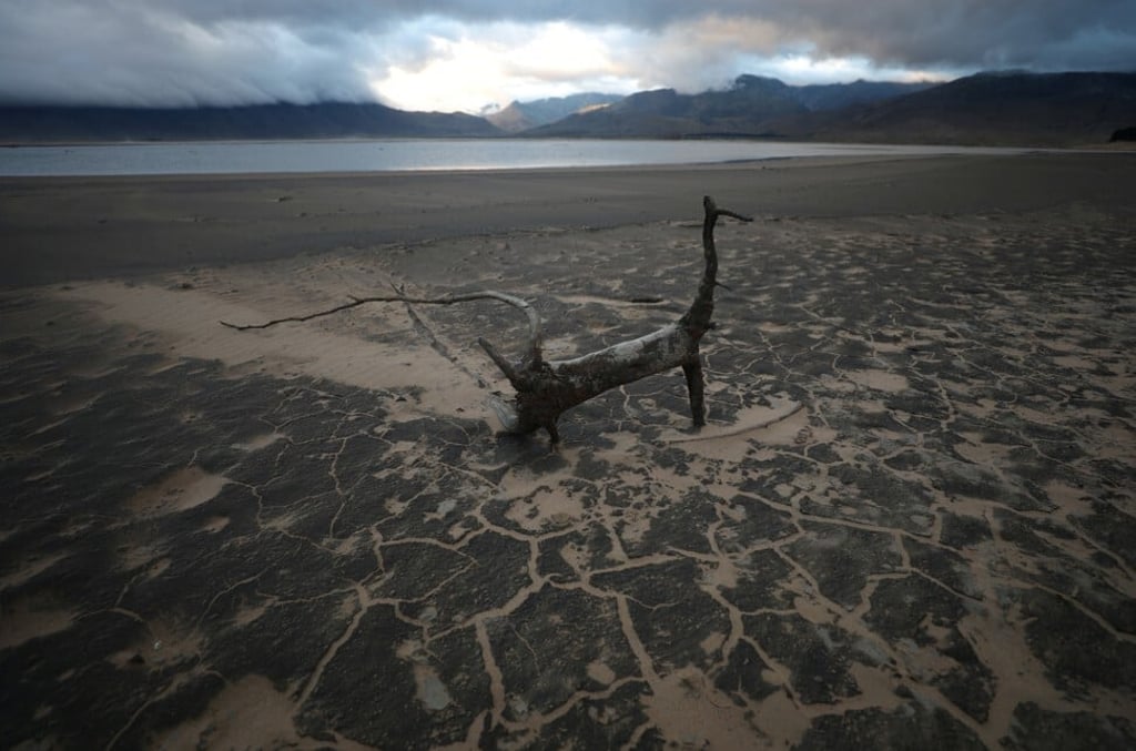 Sand blows across a normally submerged area at Theewaterskloof dam near Cape Town, South Africa. Photo: Reuters