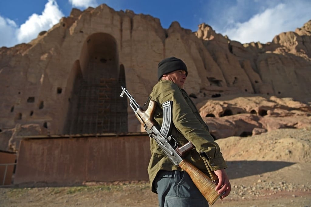 A policeman patrols the site where the statues of Buddha stood in Bamiyan before being destroyed by the Taliban in March 2001. Photo: AFP