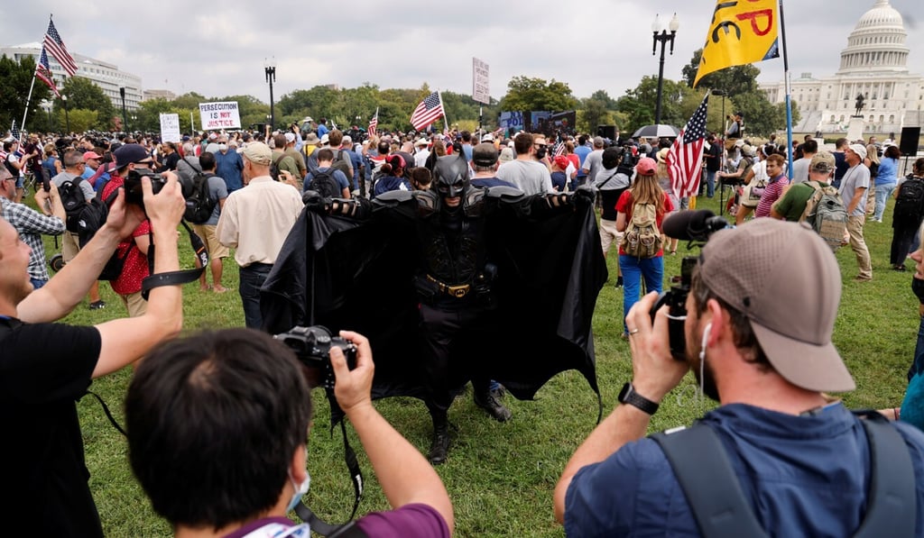 A person wearing a Batman costume poses for pictures during a rally near the US Capitol on Saturday. Photo: Reuters A person wearing a Batman costume poses for pictures during a rally near the US Capitol on Saturday. Photo: Reuters