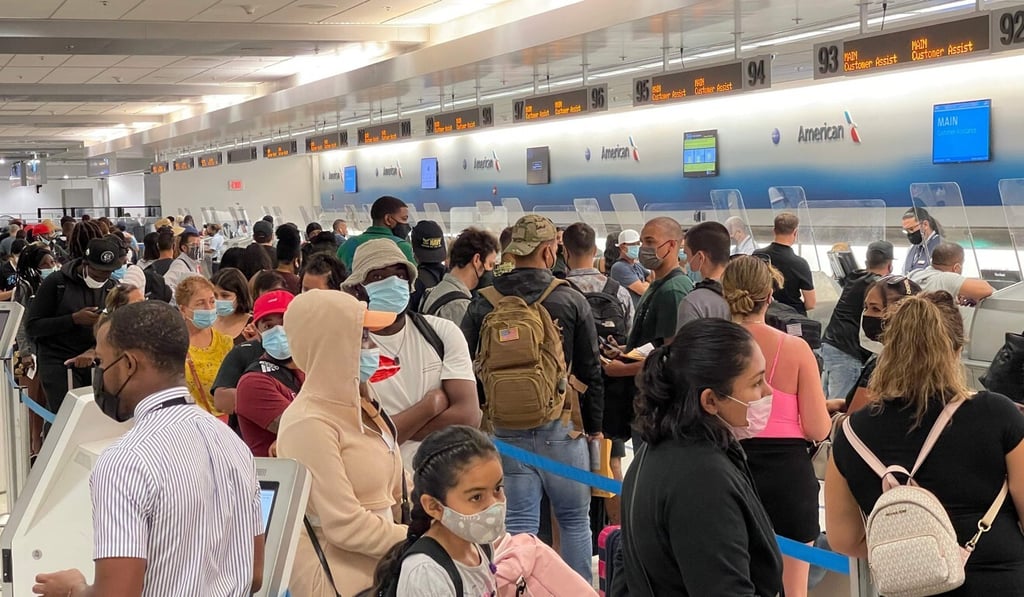 Travellers line up at Miami International Airport in August. Photo: AFP Travellers line up at Miami International Airport in August. Photo: AFP