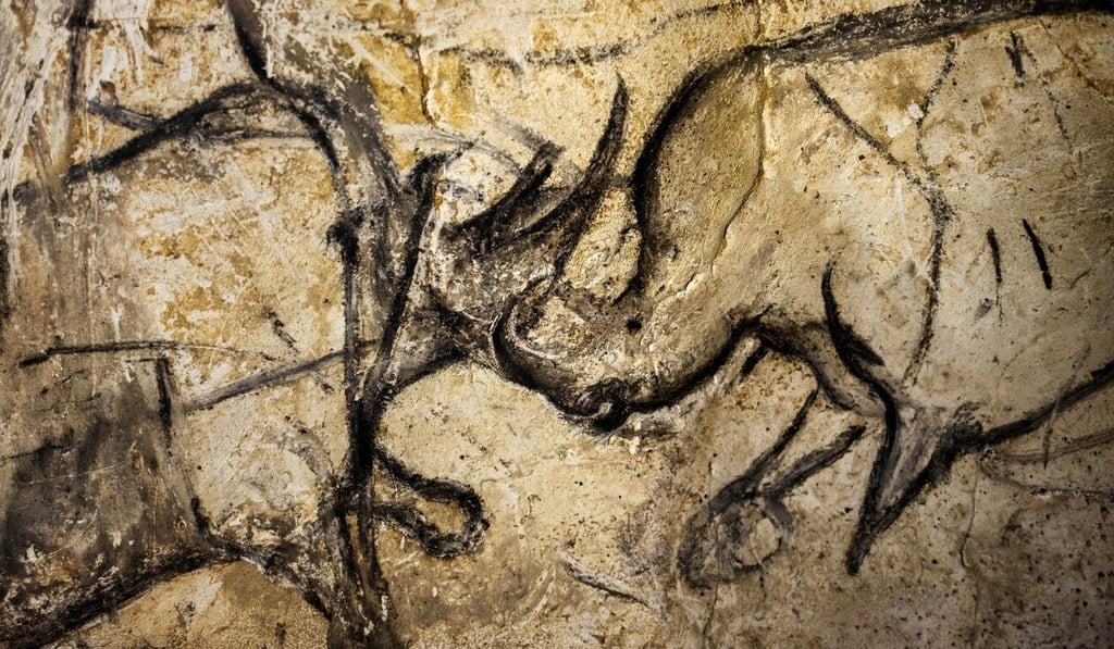 Paintings of animal figures drawn between 32,000–30,000 years ago are seen on the rock walls of the Chauvet cave in France. Photo: AFP