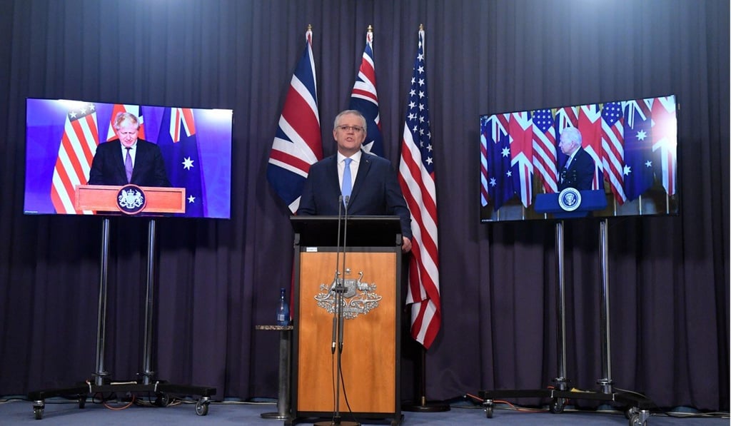 Australia‘s Prime Minister Scott Morrison, centre, at the media conference earlier this month where Canberra’s decision to build nuclear-powered submarines with the US and Britain was announced. Photo: EPA