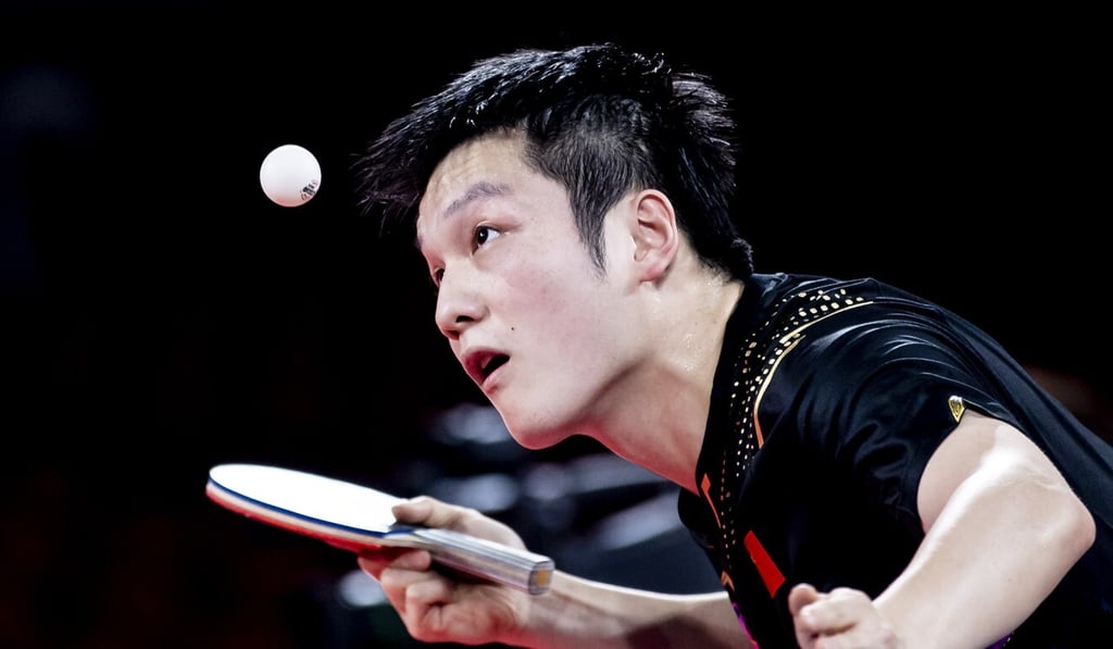 Fan serves in the men's team final against Germany at the Tokyo 2020 Olympic Games in the Tokyo Metropolitan Gymnasium in Japan. Photo: Getty Images Fan serves in the men's team final against Germany at the Tokyo 2020 Olympic Games in the Tokyo Metropolitan Gymnasium in Japan. Photo: Getty Images