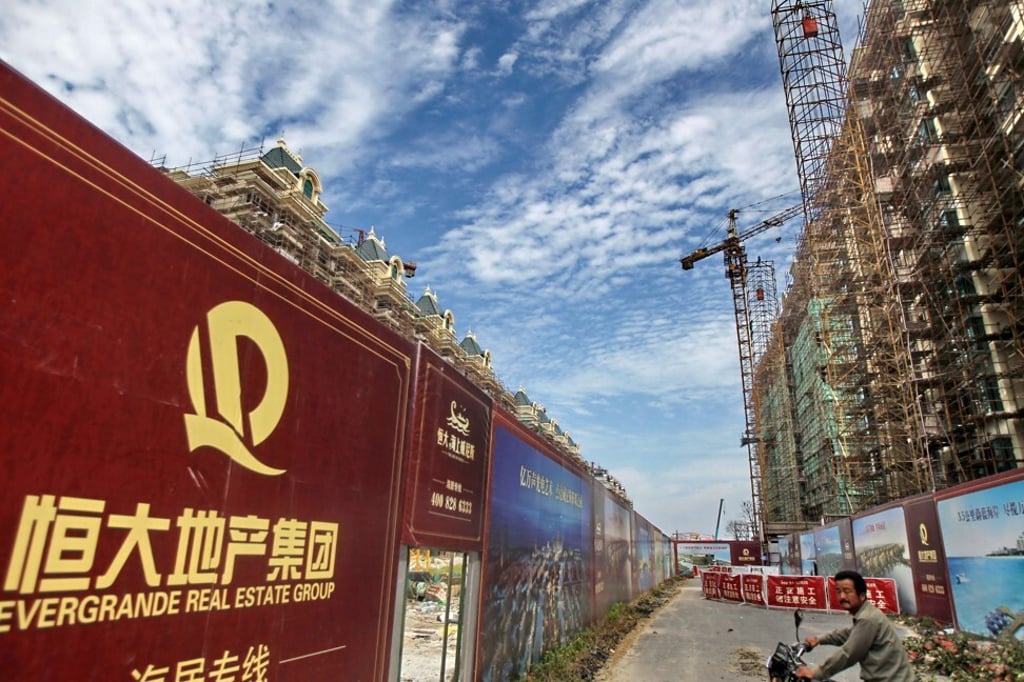 A billboard of Evergrande Real Estate Group at a construction site in the Jiangsu provincial city of Qidong, near Nantong, on 1 September 2012. Chinese Estates bought the project from Evergrande in June 2011 and then sold in 15 months later, booking a loss of HK$10.5 million. Photo: Imaginechina via AFP.