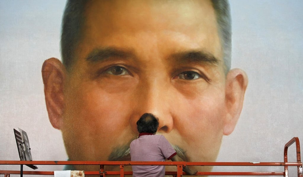 A giant portrait of Dr Sun Yat-sen, who is widely recognised as the father of modern China, goes up in Beijing. Photo: Reuters