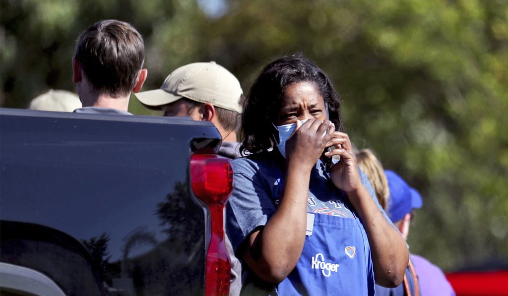A Kroger employee talks on a cellphone following a shooting at the store in Collierville, Tennessee, on Thursday. Photo: Daily Memphian via AP A Kroger employee talks on a cellphone following a shooting at the store in Collierville, Tennessee, on Thursday. Photo: Daily Memphian via AP