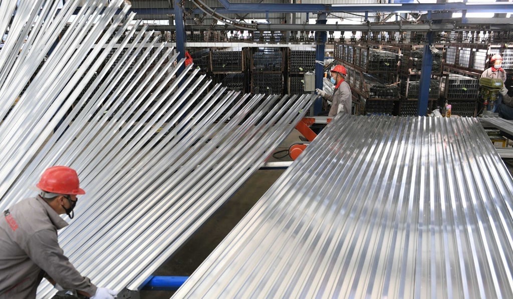 Workers at an aluminium company in Xundian industrial estate in southwest Yunnan province, where power cuts have affected the operations of many companies. Photo: Xinhua