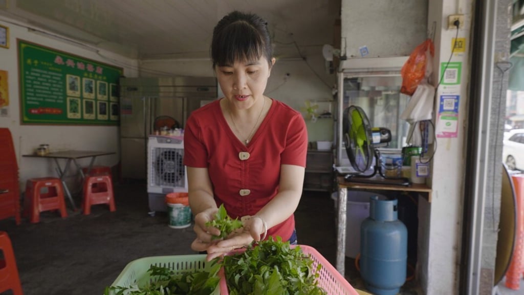 Peng Zao, chef and owner of Yong Xing Oil Tea in eastern Guangdong’s Luhe county, uses various herbs to create the signature drink at her shop.