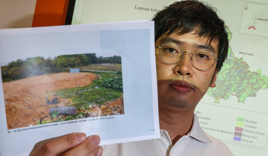 WWF-Hong Kong’s Andrew Chan displays a photo of filled-in land in South Lantau. Photo: K. Y. Cheng