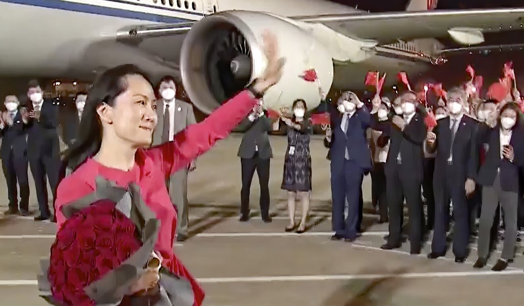 Meng Wanzhou waves to a cheering crowd in Shenzhen as she steps out of a chartered plane that brought her back from Canada after nearly three years. Photo: CCTV Meng Wanzhou waves to a cheering crowd in Shenzhen as she steps out of a chartered plane that brought her back from Canada after nearly three years. Photo: CCTV