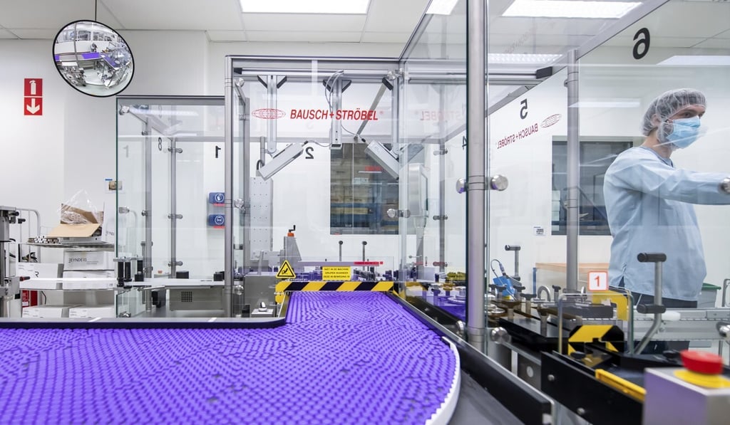 A technician works on a line for packaging preparation for the Pfizer-BioNTech Covid-19 vaccine at a company facility in Puurs, Belgium in March. Photo: Pfizer via AP A technician works on a line for packaging preparation for the Pfizer-BioNTech Covid-19 vaccine at a company facility in Puurs, Belgium in March. Photo: Pfizer via AP