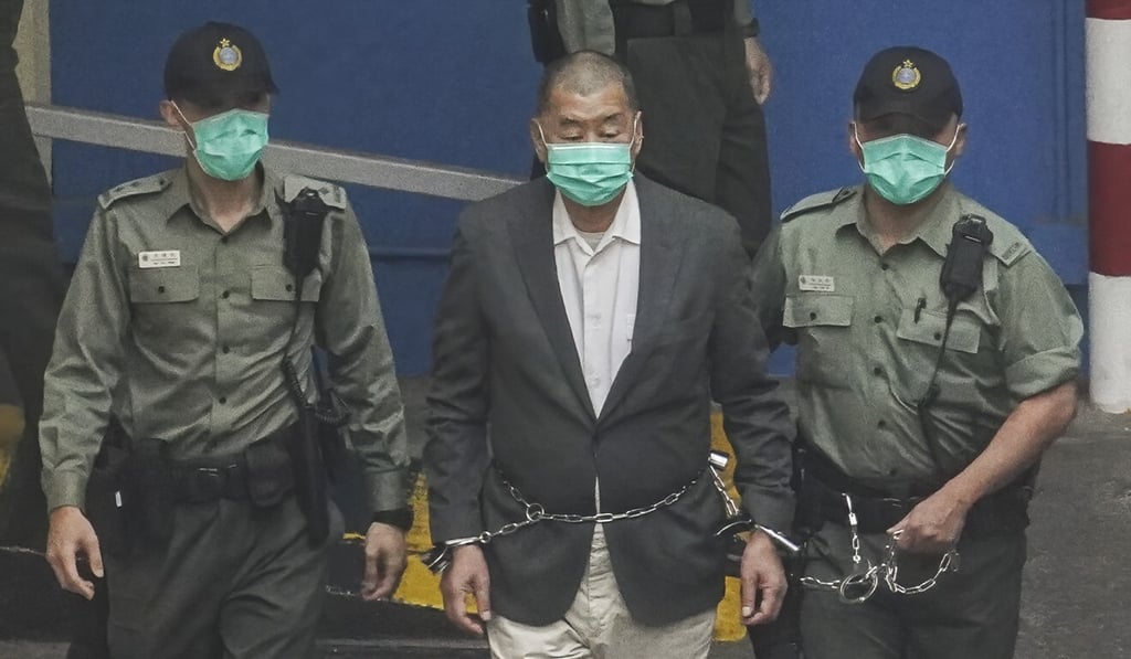 Apple Daily founder Jimmy Lai is escorted to court in December last year. Photo: Winson Wong Apple Daily founder Jimmy Lai is escorted to court in December last year. Photo: Winson Wong