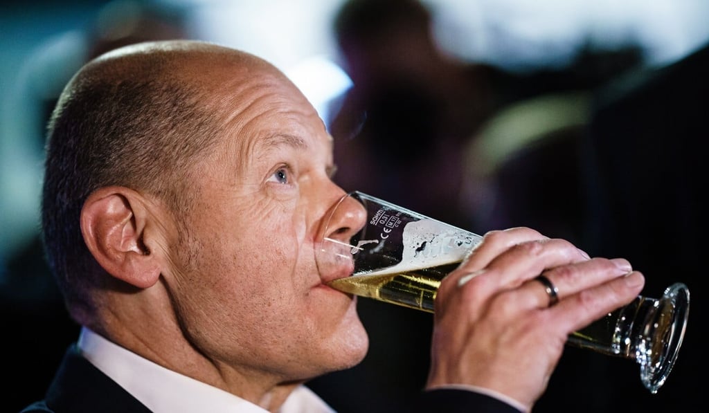 Olaf Scholz has a beer after a TV debate in Berlin on September 12. File photo: EPA