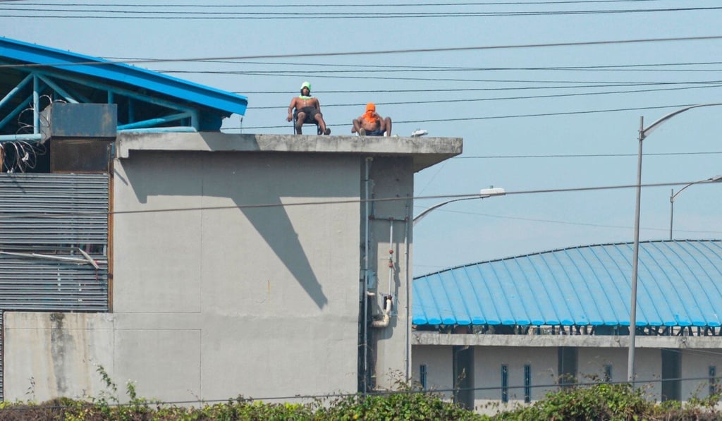 Inmates on a prison roof. Photo: AFP Inmates on a prison roof. Photo: AFP
