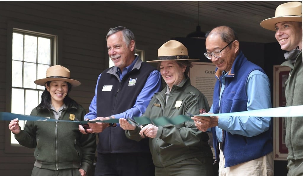 Yosemite National Park officials and guests cut the ribbon at the dedication ceremony of the restored 1917 Chinese Laundry Building. Photo: AP