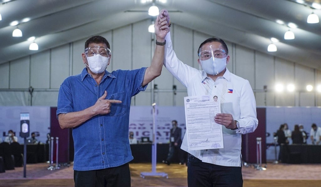 President Rodrigo Duterte, left, with Senator Christopher 'Bong' Go on Saturday as the latter filed his vice-presidential candidacy. Photo: Presidential Photographers’ Division Handout via EPA President Rodrigo Duterte, left, with Senator Christopher 'Bong' Go on Saturday as the latter filed his vice-presidential candidacy. Photo: Presidential Photographers’ Division Handout via EPA