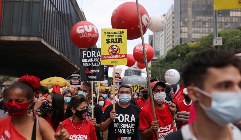 People protest against far-right President Jair Bolsonaro's administration in Sao Paulo on Saturday. Photo: Reuters People protest against far-right President Jair Bolsonaro's administration in Sao Paulo on Saturday. Photo: Reuters