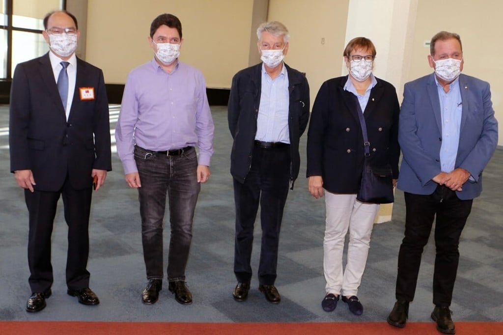 Taiwan’s deputy foreign minister Harry Tseng, left, greets French Senator Alain Richard, centre, leading a delegation arriving in Taiwan on October 6, 2021. Photo: CNA Pool