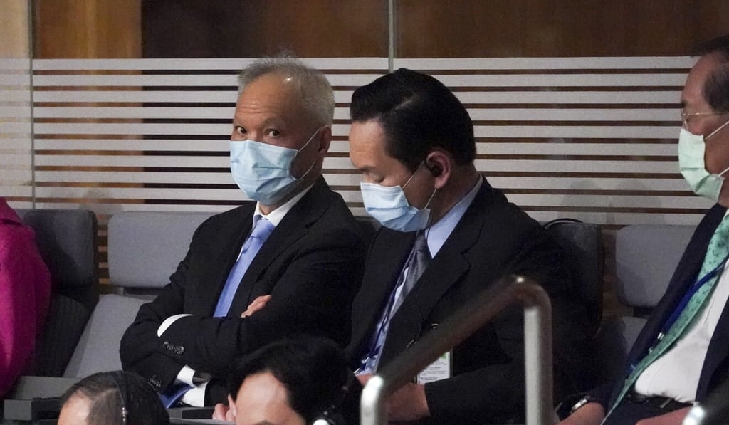 Carrie Lam’s husband, Lam Siu-por (left), listens to her speech in the legislature. Photo: Felix Wong Carrie Lam’s husband, Lam Siu-por (left), listens to her speech in the legislature. Photo: Felix Wong
