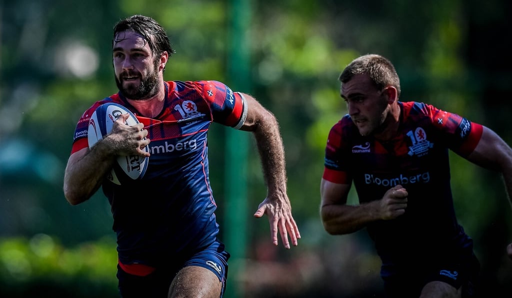 Hong Kong Scottish player Sean Taylor scores against Valley defence in round two at the Shek Kip Mei Park Sports Ground. Photo: Phoebe Leung Hong Kong Scottish player Sean Taylor scores against Valley defence in round two at the Shek Kip Mei Park Sports Ground. Photo: Phoebe Leung