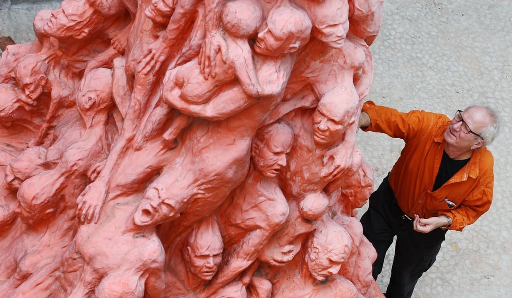 Danish sculptor Jens Galschiøt with the Pillar of Shame at the University of Hong Kong in 2013. Photo: Felix Wong Danish sculptor Jens Galschiøt with the Pillar of Shame at the University of Hong Kong in 2013. Photo: Felix Wong