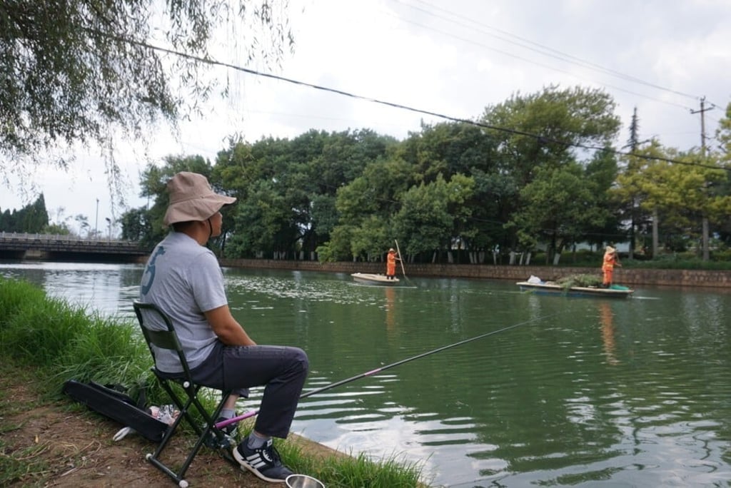 Lin Shiyong has seen the changes in the lake for himself. Photo: Echo Xie