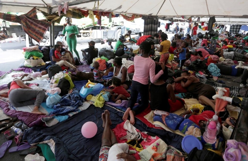 Haitian migrants seeking refuge in the US wait to be processed in Monterrey, Mexico on Monday. Photo: Reuters