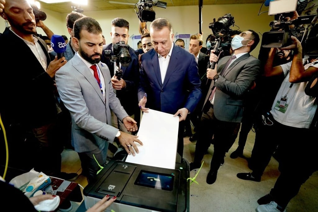 Iraqi Prime Minister Mustafa Al-Kadhimi casts his vote in Baghdad, Iraq on Sunday. Photo: Iraqi Prime Minister Media Office / Handout via Reuters