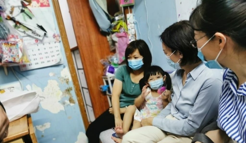 Lu Xinning visits residents in a subdivided flat in To Kwa Wan. Photo: Handout