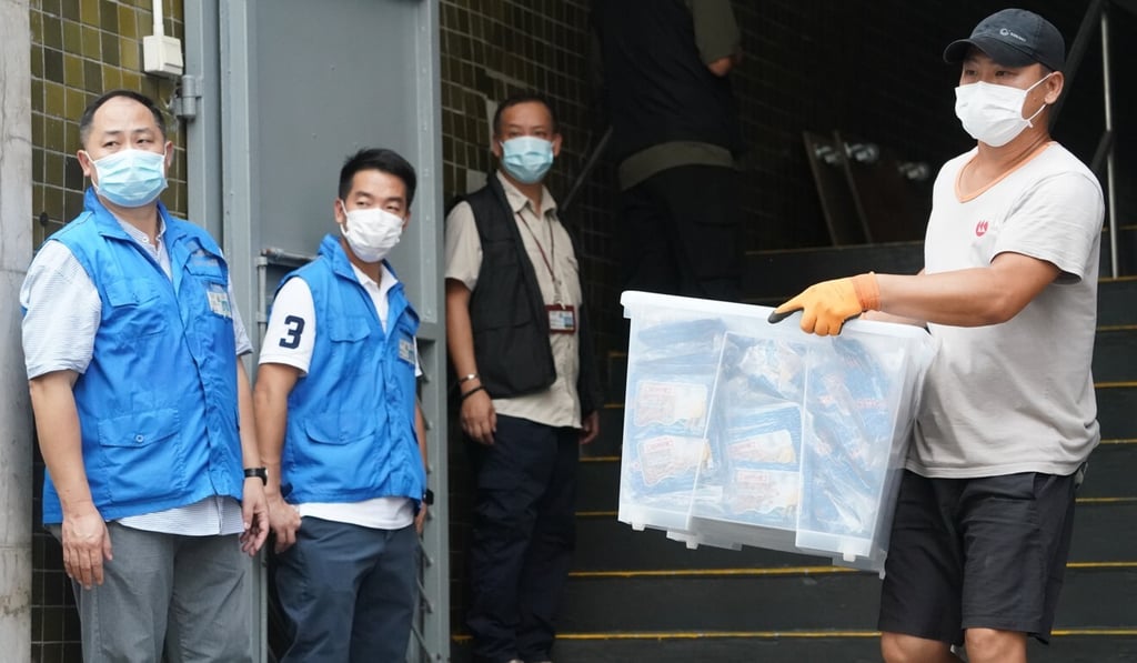 Hong Kong national security police remove boxes of documents after searching a space connected to Student Politicism. Photo: Felix Wong Hong Kong national security police remove boxes of documents after searching a space connected to Student Politicism. Photo: Felix Wong