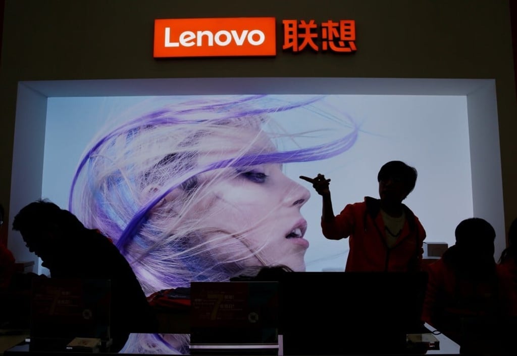 An employee gestures next to a Lenovo logo at Lenovo Tech World in Beijing in November 2019. Photo: Reuters An employee gestures next to a Lenovo logo at Lenovo Tech World in Beijing in November 2019. Photo: Reuters