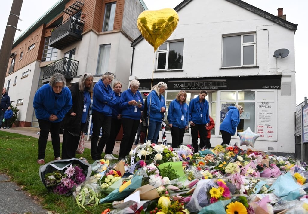 Members of the public leave flowers for David Amess near the crime scene in Leigh-on-Sea. Photo: EPA-EFE