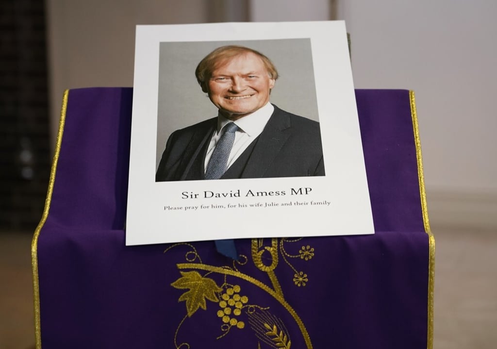 A photo of British politician David Amess is displayed in St Peters Catholic Church before a vigil in Leigh-on-Sea, Essex, England on Friday. Photo: AP A photo of British politician David Amess is displayed in St Peters Catholic Church before a vigil in Leigh-on-Sea, Essex, England on Friday. Photo: AP