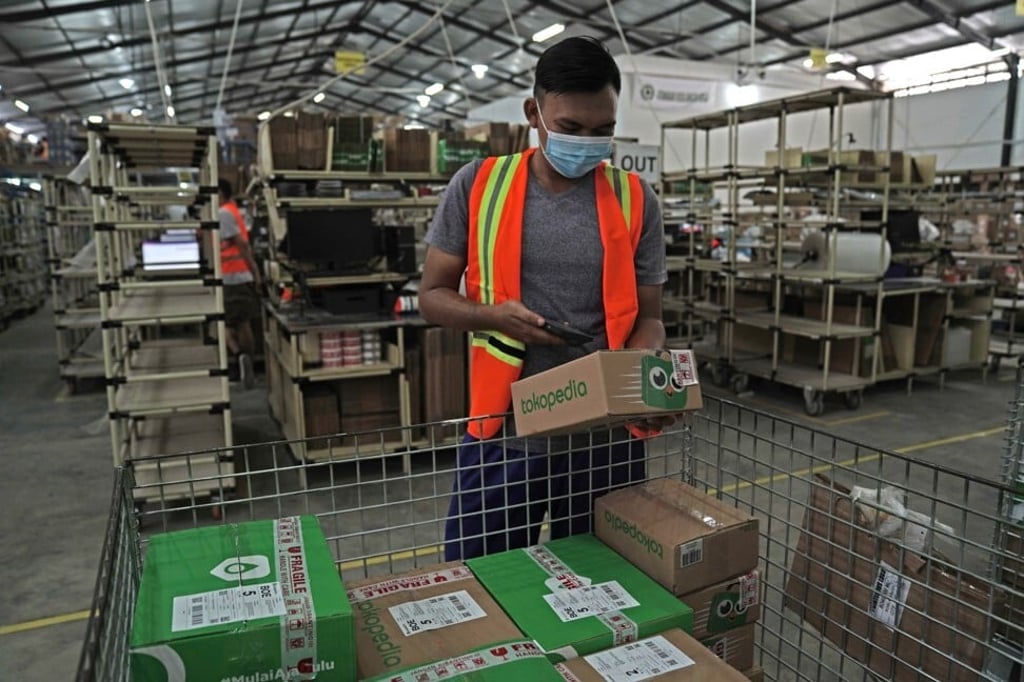 A worker handles a Tokopedia order at a fulfilment centre in Jakarta, Indonesia. Photo: Bloomberg