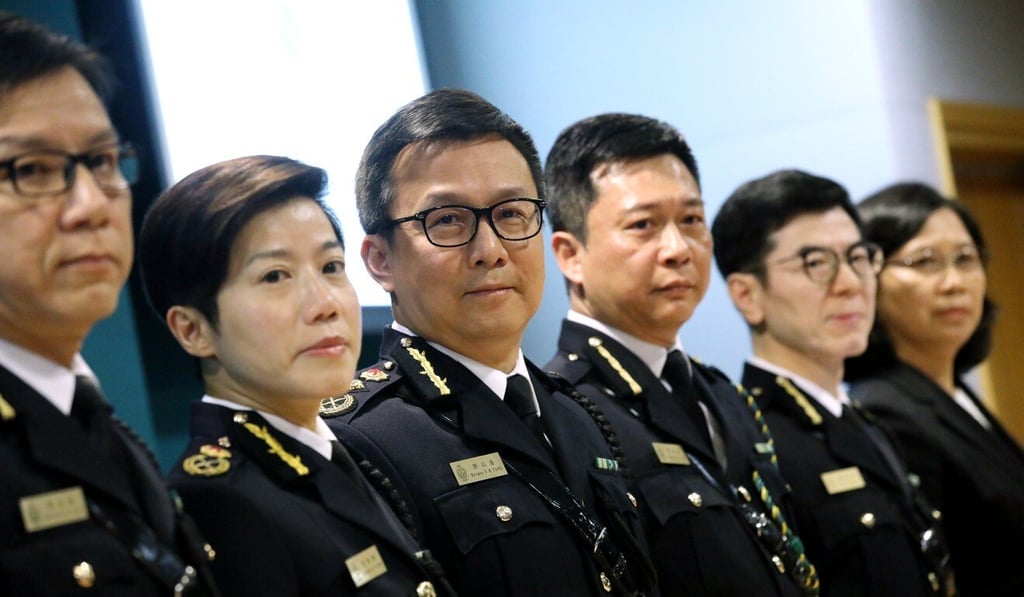 Customs chief Louise Ho (second left) standing beside her former boss Hermes Tang (centre) in January 2019. Photo: Dickson Lee