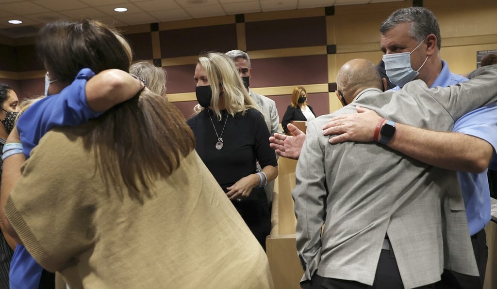 Family members of the Parkland shooting victims embrace during a court recess in Fort Lauderdale, Florida, on Wednesday. Photo: South Florida Sun Sentinel via AP Family members of the Parkland shooting victims embrace during a court recess in Fort Lauderdale, Florida, on Wednesday. Photo: South Florida Sun Sentinel via AP