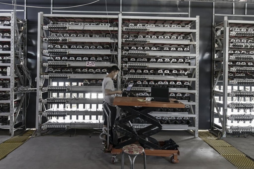 A technician inspects bitcoin mining machines at a facility in Inner Mongolia on August 11, 2017. Before Beijing’s crackdown earlier this year, China accounted for two-thirds of global bitcoin mining activity. Photo: Bloomberg A technician inspects bitcoin mining machines at a facility in Inner Mongolia on August 11, 2017. Before Beijing’s crackdown earlier this year, China accounted for two-thirds of global bitcoin mining activity. Photo: Bloomberg