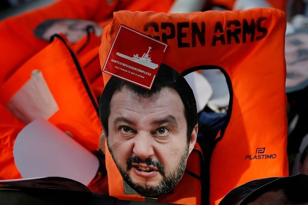 A mask of Italian Interior Minister Matteo Salvini lies on life jackets during a protest in Barcelona in 2019. Photo: AFP