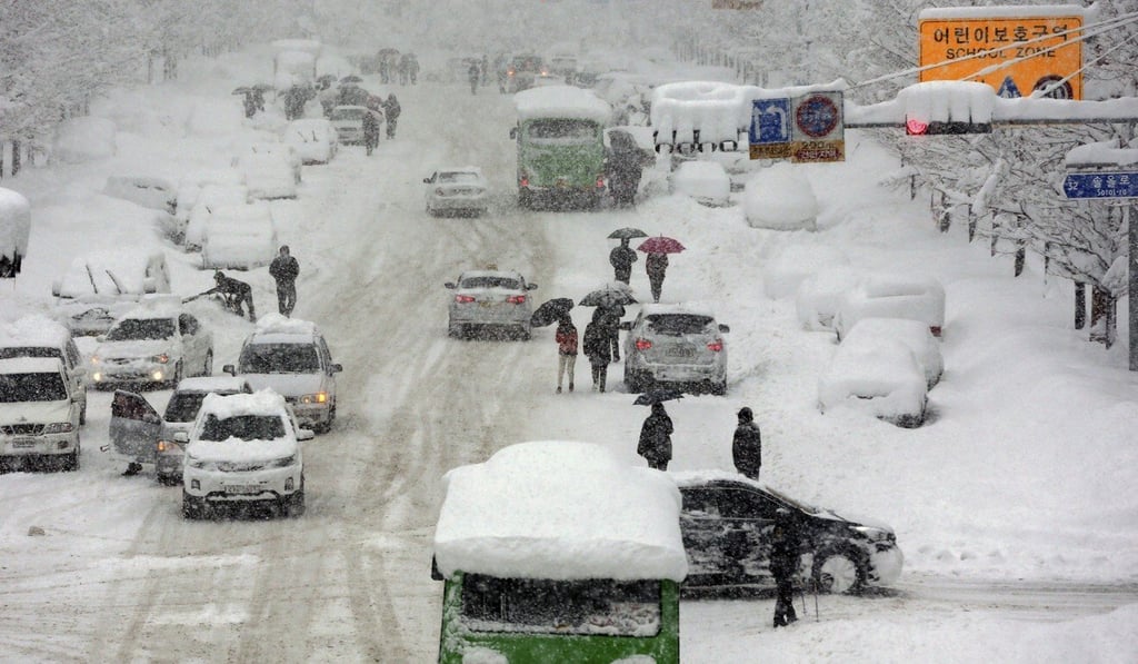 A road in South Korea is seen covered with heavy snow in this file photo. The country is expected to see colder weather in the first half of this winter. Photo: AP