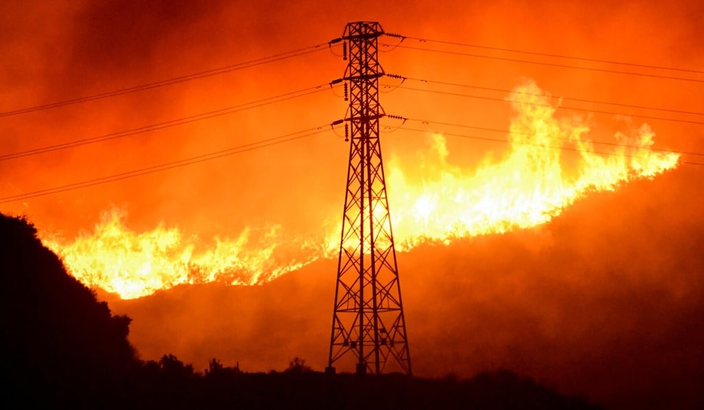 A wind-driven wildfire burns in Sylmar, California in October 2019. Photo: Reuters