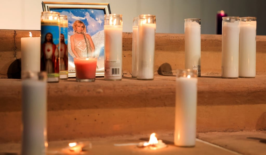 A photo of cinematographer Halyna Hutchins rests among candles at a vigil in Albuquerque, New Mexico, on Saturday. Photo: Reuters