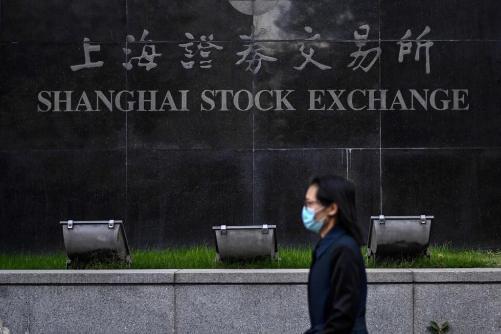 Shanghai Stock Exchange’s benchmark index weathered the regulatory onslaught far better than the Hang Seng Index in Hong Kong in the third quarter. Photo: AFP Shanghai Stock Exchange’s benchmark index weathered the regulatory onslaught far better than the Hang Seng Index in Hong Kong in the third quarter. Photo: AFP