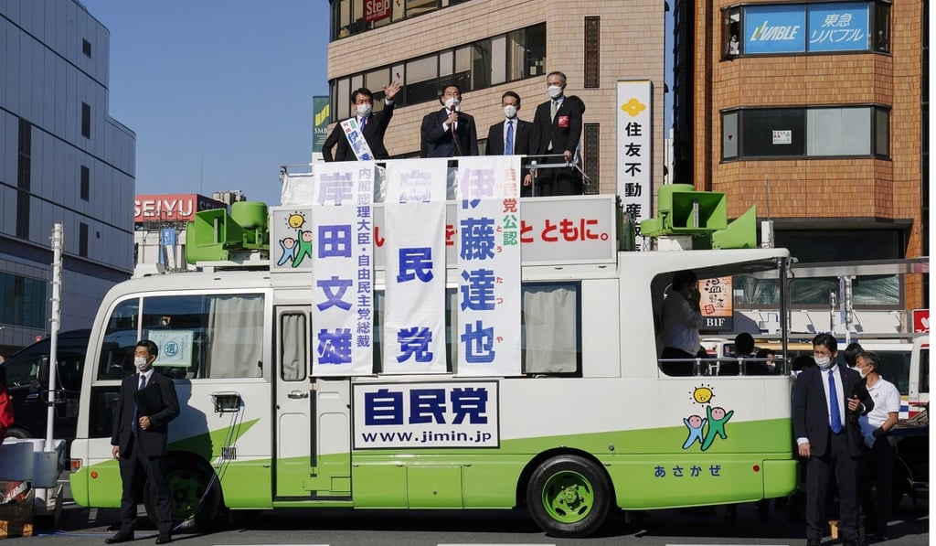 Japanese Prime Minister Fumio Kishida delivers a speech from the roof of a campaign van during an election event ahead of Sunday’s election. Photo: EPA-EFE
