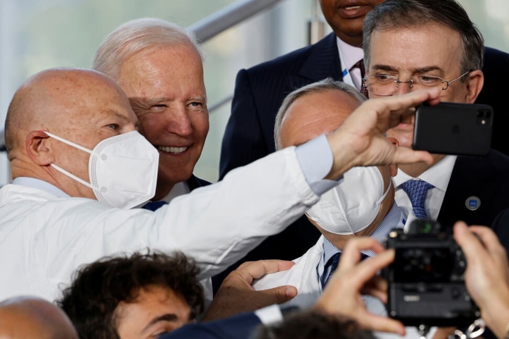 A member of the Italian medical team takes a selfie with US President Joe Biden at the start of the G20 leaders summit in Rome, Italy on Saturday. Photo: Reuters A member of the Italian medical team takes a selfie with US President Joe Biden at the start of the G20 leaders summit in Rome, Italy on Saturday. Photo: Reuters