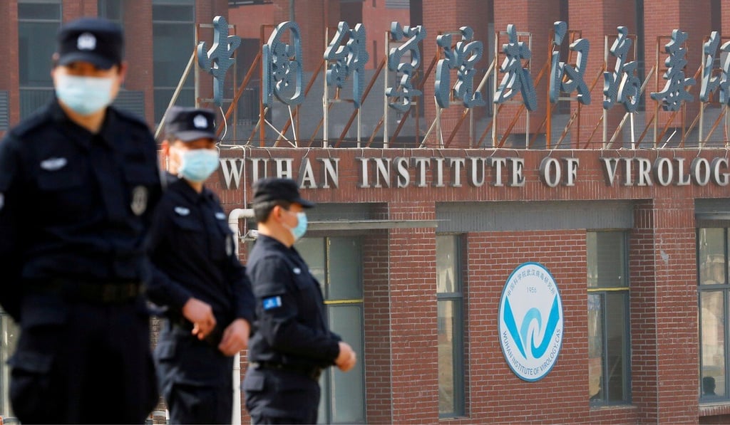 Security personnel keep watch outside Wuhan Institute of Virology during the visit by the World Health Organization team tasked with investigating the origins of Covid-19 on February 3. Photo: Reuters Security personnel keep watch outside Wuhan Institute of Virology during the visit by the World Health Organization team tasked with investigating the origins of Covid-19 on February 3. Photo: Reuters