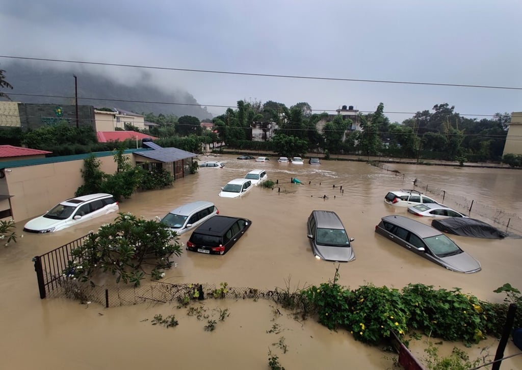 Submerged cars after heavy rainfall caused the Kosi River to overflow at the Jim Corbett National Park in Uttarakhand, India on October 19. Photo: AP