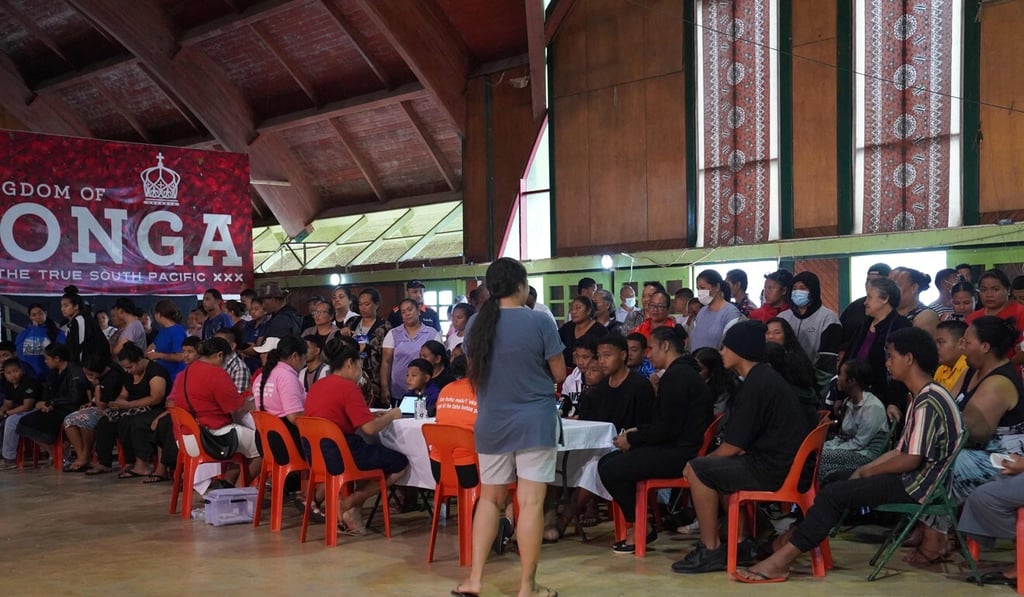 People queuing inside Queen Salote Memorial Hall in Nuku‘alofa, Tonga in October to be vaccinated against Covid-19. Photo: Matangi Tonga via AFP