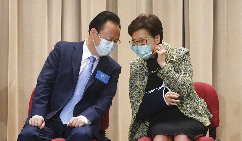 Tan Tieniu (left), deputy chief of the liaison office, and Hong Kong leader Carrie Lam at the opening ceremony on Tuesday. Photo: Winson Wong