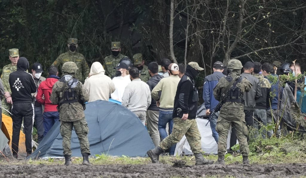 Polish security forces block migrants from crossing the country’s border with Belarus in September. Photo: AP
