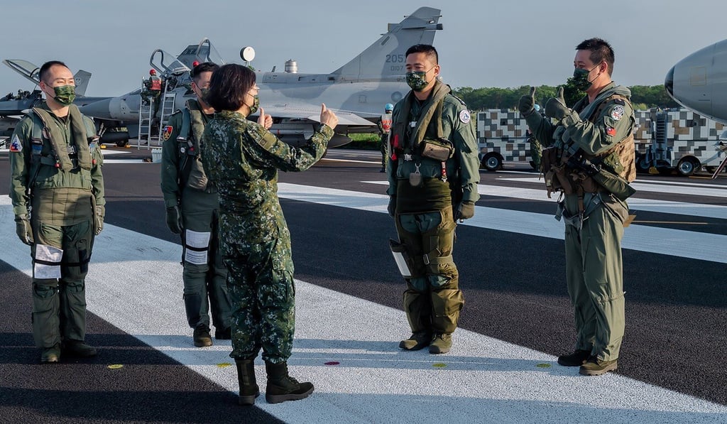 Taiwanese President Tsai Ing-wen (centre) speaks with military personnel near aircraft parked on a highway in Jiadong, Taiwan in September. Mark Milley (not pictured) on Wednesday dodged questions about the US government’s strategy of “strategic ambiguity” with respect to Taiwan. Photo: Taiwan Presidential Office via AP